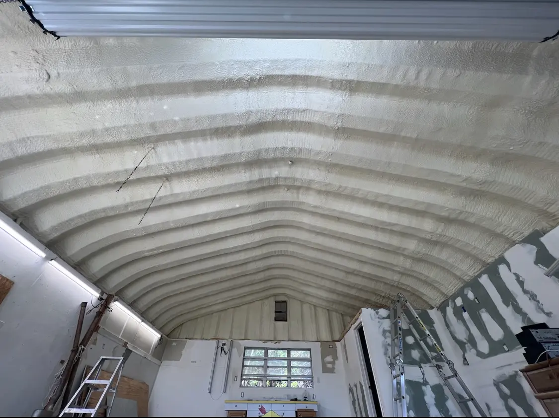 Spray polyurethane foam applied to the underside of a metal roof deck in American Falls